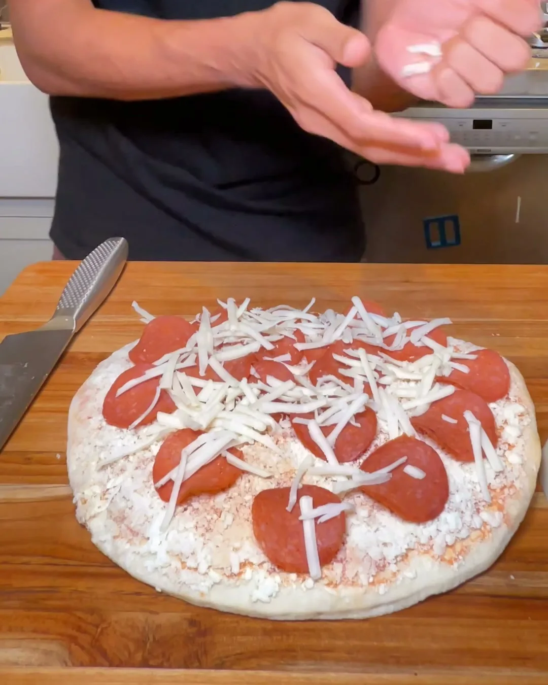 Yough pizza with turkey pepperoni and mozzarella before baking