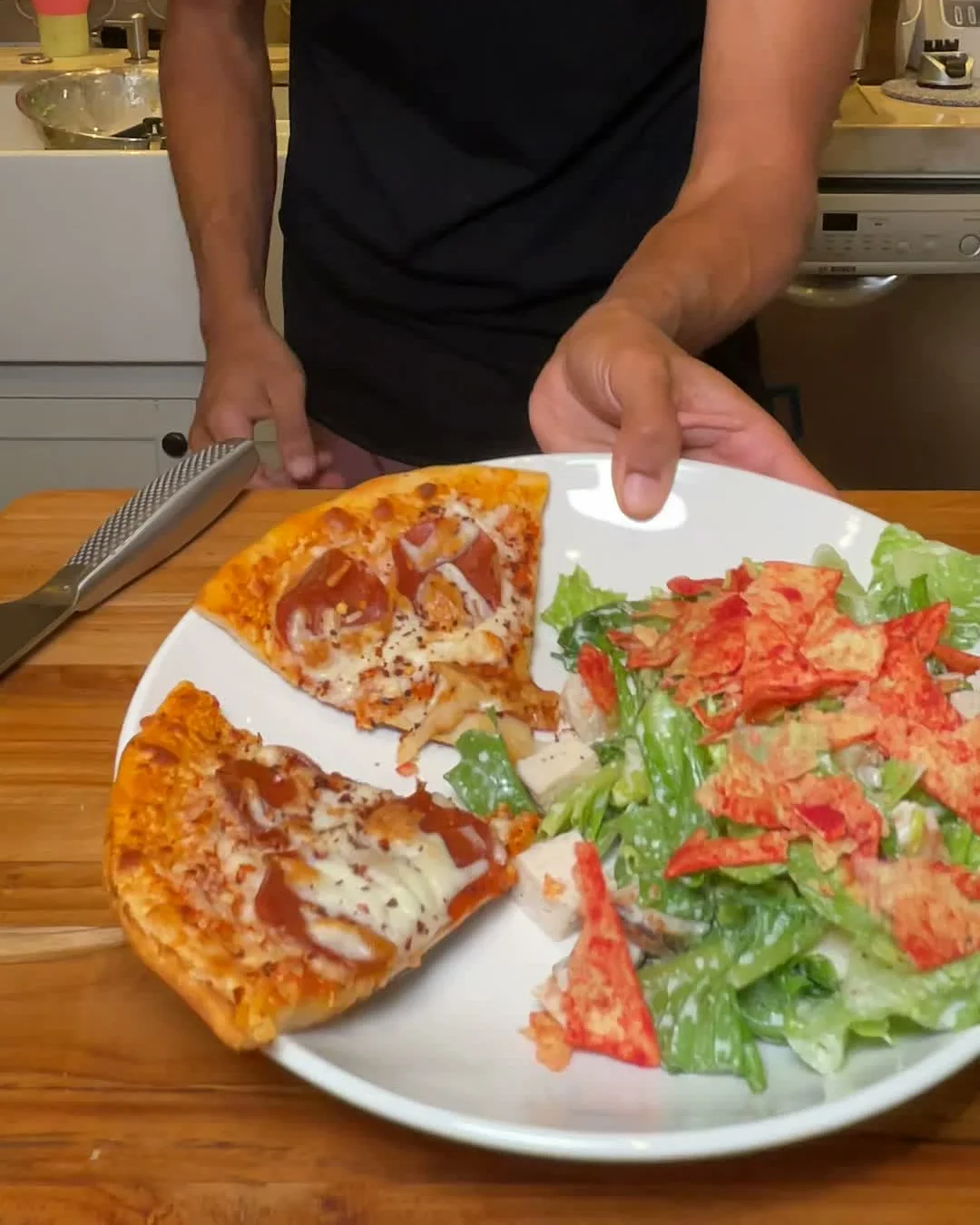 Filmed adult pizza and chicken Caesar plate